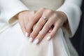 Wedding nail design of the bride, beautiful hands of the bride with well-groomed manicure