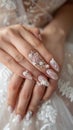Wedding nail design of the bride, beautiful hands of the bride with well-groomed manicure