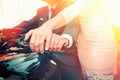 Wedding, newlyweds. A man and a woman in wedding attire hold on to a motorcycle handle, showing off their engagement rings. Hands Royalty Free Stock Photo