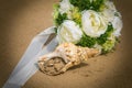 Wedding on the ocean. wedding bouquet and rings in a shell Royalty Free Stock Photo