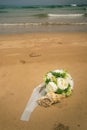 Wedding on the ocean. wedding bouquet and rings in a shell Royalty Free Stock Photo