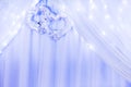 Wedding ornament with two hearts and curtain and lights. Royalty Free Stock Photo