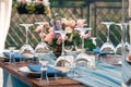 Wedding or Event decoration table setup, blue napkins, flowers, Royalty Free Stock Photo