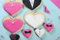 Wedding party heart shape cookies on vintage blue tray - close up