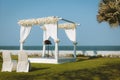 Wedding pavilion set for an outdoor garden wedding by the sea Royalty Free Stock Photo