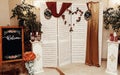 Wedding photo booth zone and welcome board. rustic wooden wall w Royalty Free Stock Photo