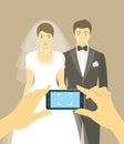 Wedding photo of bride and groom by mobile phone Royalty Free Stock Photo