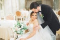 Wedding photo shoot of the newlyweds couple posing in a beautiful hotel Royalty Free Stock Photo