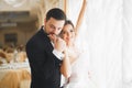 Wedding photo shoot of the newlyweds couple posing in a beautiful hotel Royalty Free Stock Photo