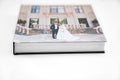 Wedding photobook with thick pages on white table