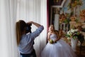 Wedding photographer is shooting portrait of the bride Royalty Free Stock Photo