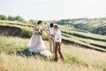 Wedding photographer takes pictures of bride and groom in nature, fine art photo Royalty Free Stock Photo