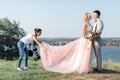 Wedding photographer takes pictures of bride and groom Royalty Free Stock Photo