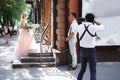 Wedding photographer takes pictures of bride and groom Royalty Free Stock Photo