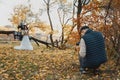 wedding photographer taking pictures of the bride and groom Royalty Free Stock Photo