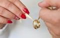 Newlyweds hold wedding rings on a string Royalty Free Stock Photo