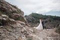 Wedding photography of a young couple, the bride and groom in a mountainous area in summer