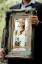 Wedding picture, elegant bride throw antique mirror Royalty Free Stock Photo