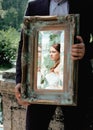 Wedding picture, elegant bride throw antique mirror Royalty Free Stock Photo