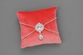 Wedding Pillow for Rings decorated with jewel. Luxury pillow in coral color