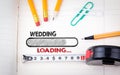 Wedding Planner Notebook. pencils, pen and tape measure on a paper background Royalty Free Stock Photo