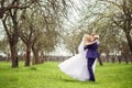 Wedding portrait of the bride and groom in the spring garden Royalty Free Stock Photo