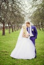 Wedding portrait of the bride and groom in the spring garden Royalty Free Stock Photo