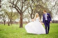 Wedding portrait of the bride and groom in the spring garden Royalty Free Stock Photo