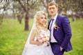 Wedding portrait of the bride and groom in the spring garden Royalty Free Stock Photo