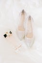 Bridal accessories. Bridal shoes, perfume and crown. Royalty Free Stock Photo