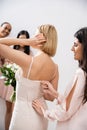 wedding preparations, happy bridesmaid zipping wedding