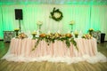 Wedding presidium table with pink tablecloth