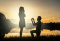 Wedding proposal concept. Young couple have dating at sun set.