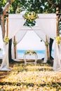 Wedding reception, ceremony venue on beach with flower details and ocean view Royalty Free Stock Photo