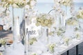 The white cream roses, orchids decoration on the reception dinner table, flowers, Floral - closed up Royalty Free Stock Photo