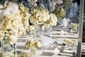 The white cream roses, orchids decoration on the reception dinner table, flowers, Floral - closed up Royalty Free Stock Photo