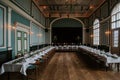 Wedding reception hall with an elegant table setting with candles