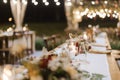 Wedding reception night dinner setup table with beautiful flower decoration Royalty Free Stock Photo
