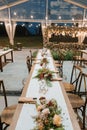 Wedding reception night dinner setup table with beautiful flower decoration Royalty Free Stock Photo