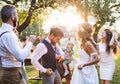 Bride and groom dancing at wedding reception outside in the backyard. Royalty Free Stock Photo