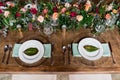 Wedding reception table setting with flower arrangements