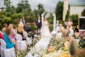 Wedding registration. Outdoor wedding ceremony in nature. Photo out of focus. Silhouettes of the newlyweds