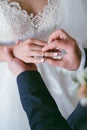 wedding ring on the finger. The groom puts the ring on the bride. wedding Royalty Free Stock Photo