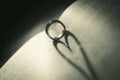 Wedding ring on the page of a book in a heart shape Royalty Free Stock Photo