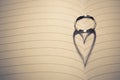 Wedding ring with heart shape shadow on paper Royalty Free Stock Photo