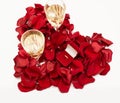 Wedding ring red box surrounded by rose petals. An offer of marriage. Heart-shaped rose petals Royalty Free Stock Photo
