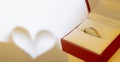 Wedding ring and abstract heart background, the concept of love and marriage.