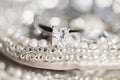 Wedding ring on sequins and pearls Royalty Free Stock Photo