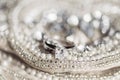 Wedding ring on sequins and pearls Royalty Free Stock Photo