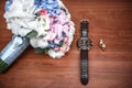 Wedding ring and watch groom on the table